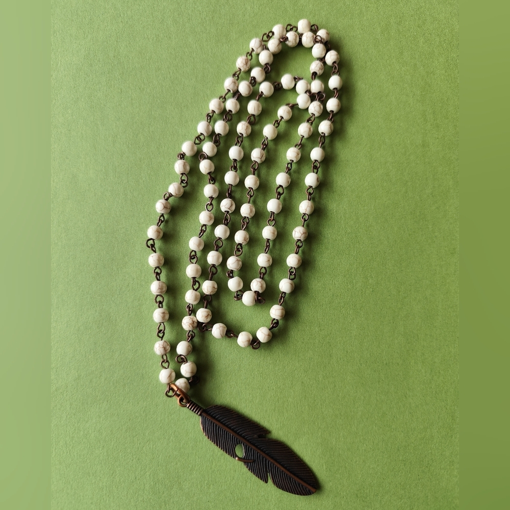 Elegant White Beaded Necklace with Feather Pendant